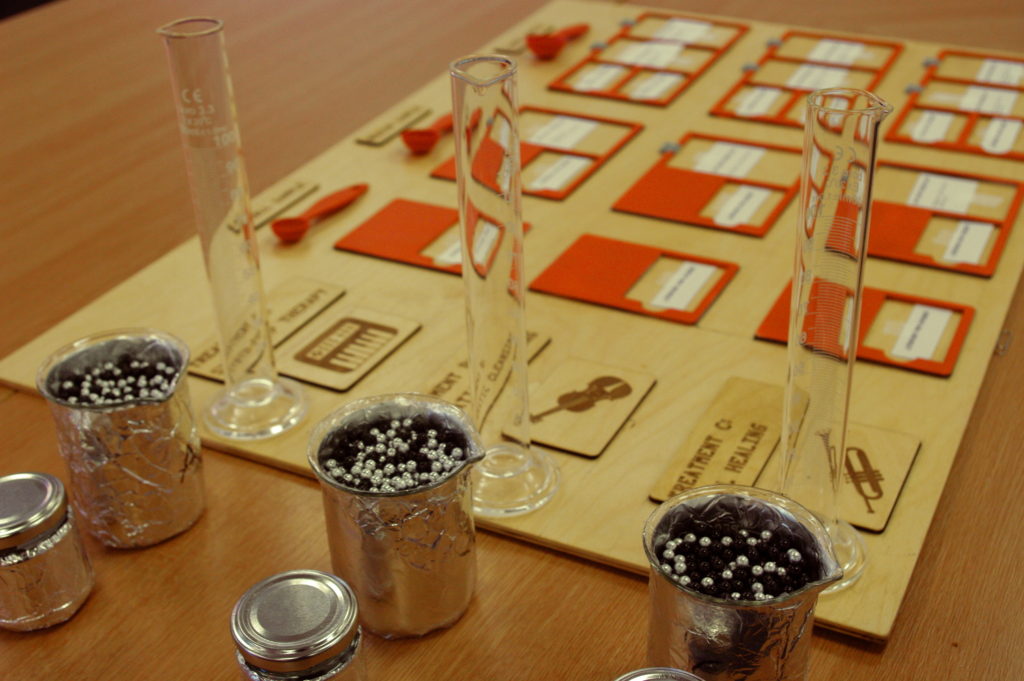 A board game with test tubes and beakers