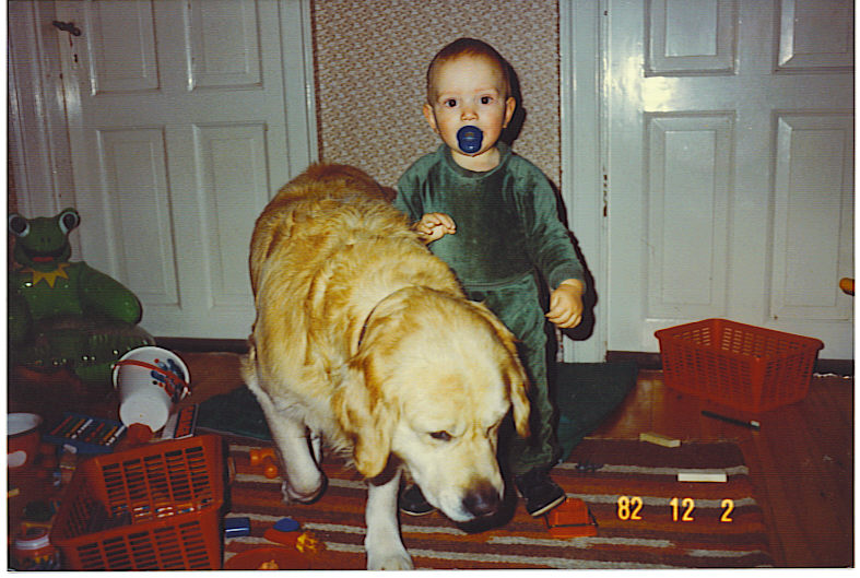 Old photo of a baby and a dog